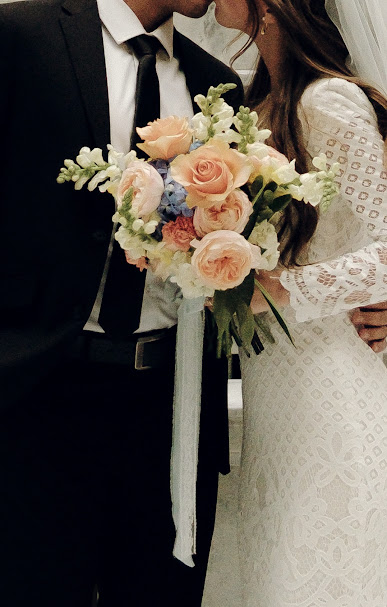 Bride and groom with romantic bridal bouquet
