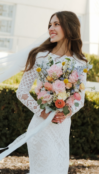 Bride holding beautiful floral bouquet